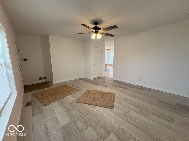 844 Ben Franklin St, Cloverdale, IN 46120 - unfurnished room with a ceiling fan, light wood-style floors, and baseboards