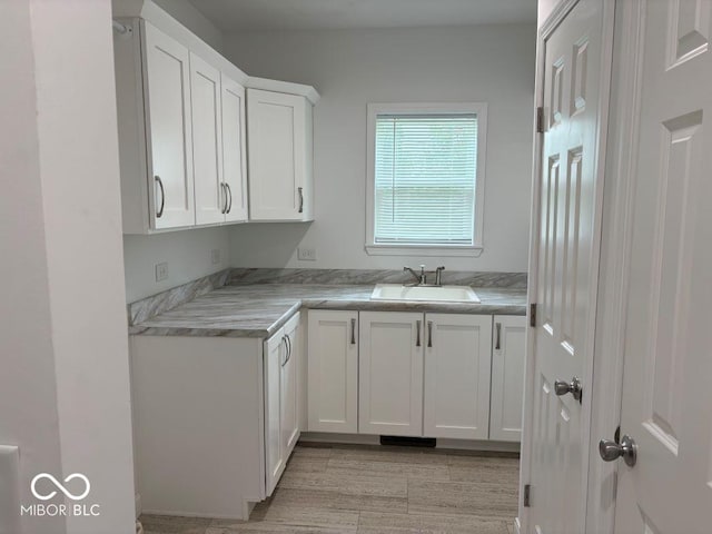 844 Ben Franklin St, Cloverdale, IN 46120 - kitchen with a sink, white cabinets, and light countertops