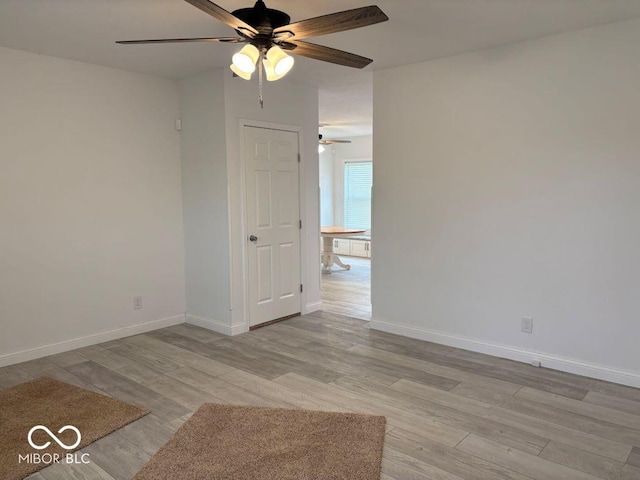 844 Ben Franklin St, Cloverdale, IN 46120 - unfurnished room featuring a ceiling fan, wood finished floors, and baseboards