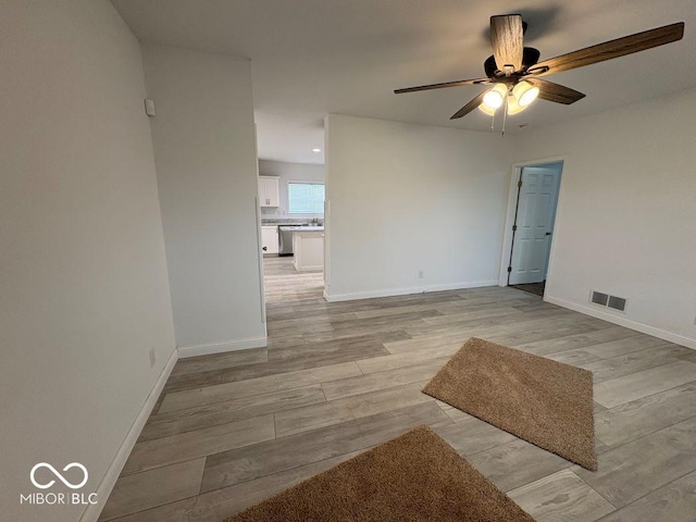 844 Ben Franklin St, Cloverdale, IN 46120 - spare room featuring a ceiling fan, light wood finished floors, and baseboards