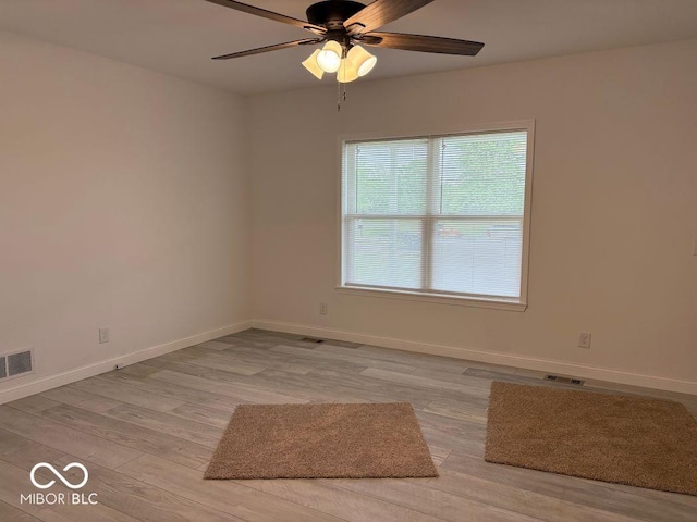 844 Ben Franklin St, Cloverdale, IN 46120 - empty room with a ceiling fan, light wood-type flooring, and baseboards