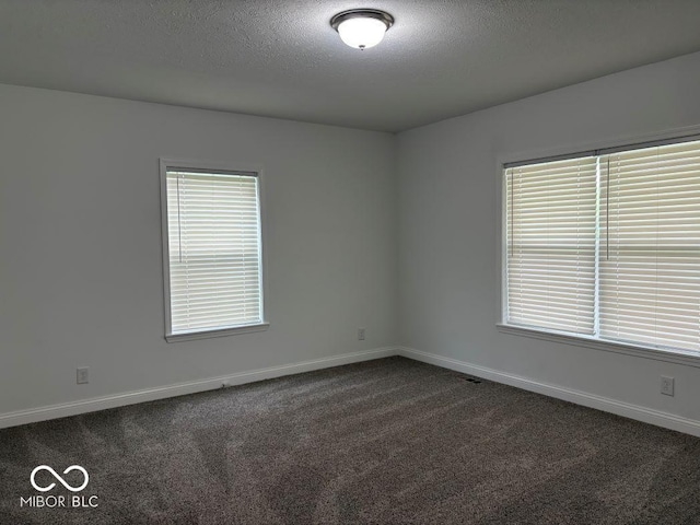 844 Ben Franklin St, Cloverdale, IN 46120 - unfurnished room featuring dark carpet, a textured ceiling, and baseboards