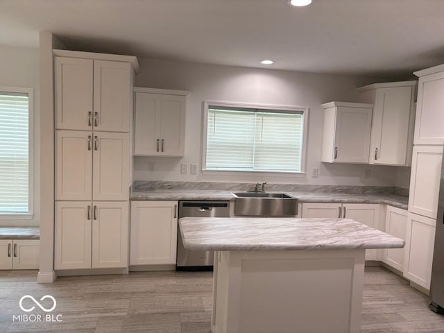 844 Ben Franklin St, Cloverdale, IN 46120 - kitchen featuring stainless steel dishwasher, a sink, recessed lighting, white cabinets, and a kitchen island