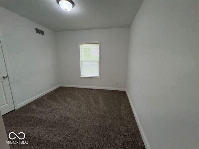 844 Ben Franklin St, Cloverdale, IN 46120 - empty room with dark carpet and baseboards