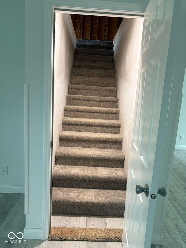 844 Ben Franklin St, Cloverdale, IN 46120 - staircase featuring baseboards and wood finished floors