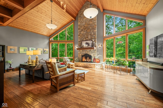 2369 Turning Tree Dr, Nashville, IN 47448 - living area with wooden ceiling, high vaulted ceiling, hardwood / wood-style floors, a fireplace, and baseboards