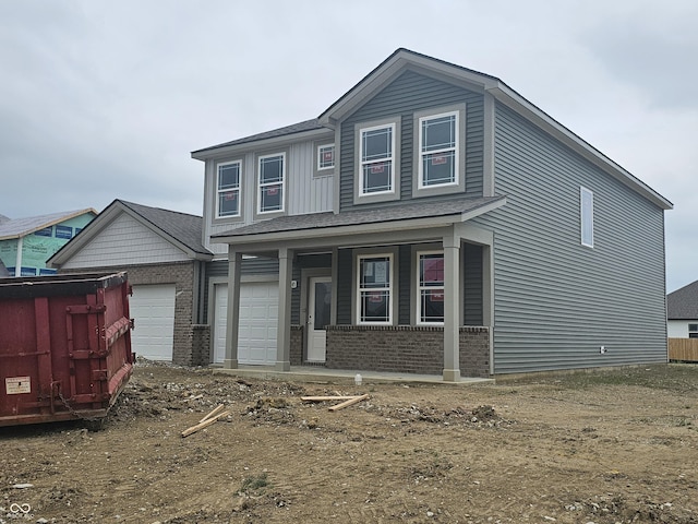 2287 Oakmont Dr, Plainfield, IN 46168 - view of front of home with a porch, brick siding, and a garage