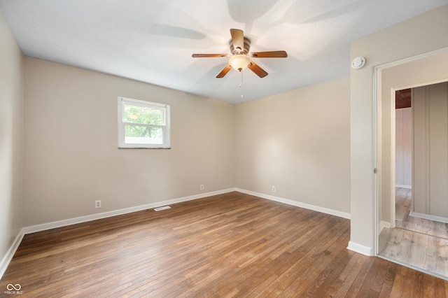 7482 W US Highway 40, Indianapolis, IN 46229 - unfurnished room featuring ceiling fan, wood-type flooring, baseboards, and a smoke detector