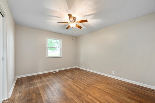 7482 W US Highway 40, Indianapolis, IN 46229 - spare room featuring wood-type flooring, ceiling fan, and baseboards