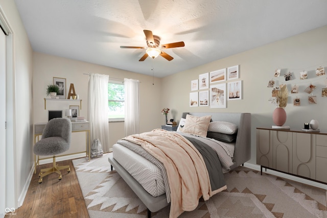7482 W US Highway 40, Indianapolis, IN 46229 - bedroom featuring wood finished floors, baseboards, and a ceiling fan