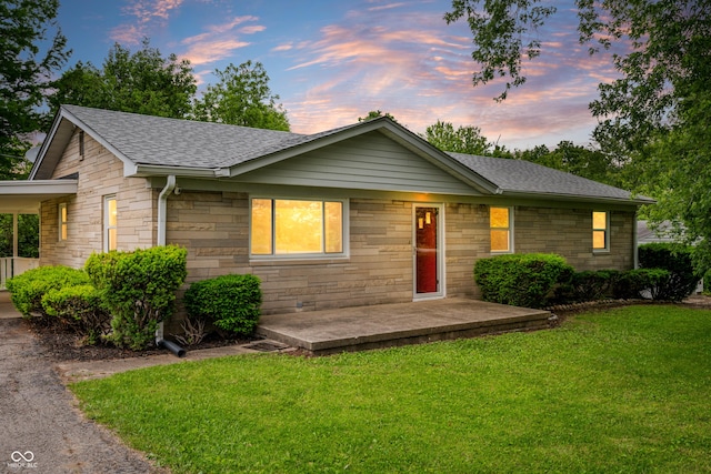 7482 W US Highway 40, Indianapolis, IN 46229 - ranch-style house with a lawn, a shingled roof, and stone siding