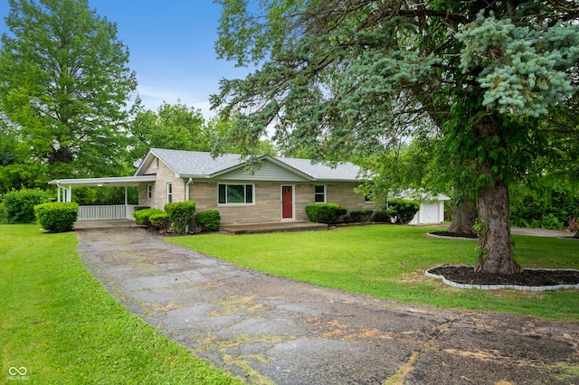 7482 W US Highway 40, Indianapolis, IN 46229 - ranch-style home with asphalt driveway, a front lawn, and a shingled roof