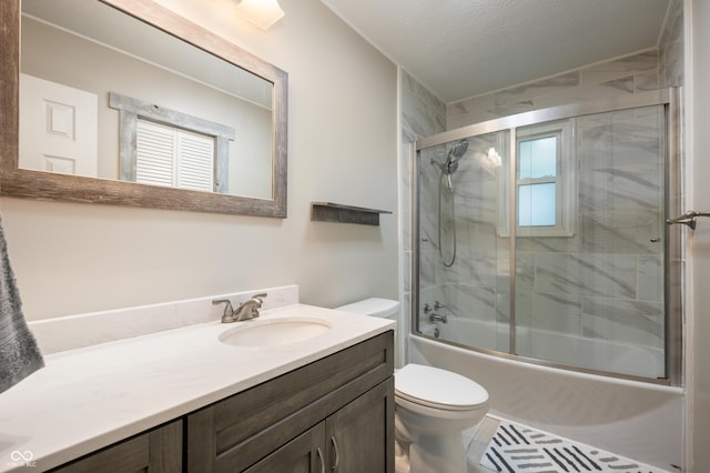 7482 W US Highway 40, Indianapolis, IN 46229 - bathroom with toilet, vanity, and combined bath / shower with glass door