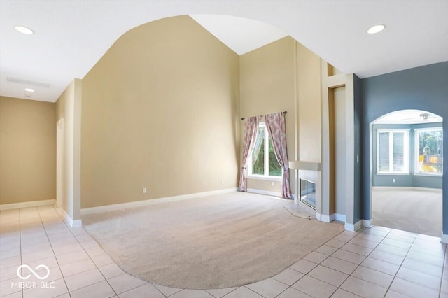 11575 Freeport Dr, Carmel, IN 46032 - empty room with light carpet, light tile patterned floors, baseboards, and recessed lighting