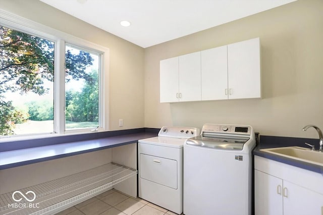 11575 Freeport Dr, Carmel, IN 46032 - laundry room featuring cabinet space, washer and clothes dryer, and light tile patterned flooring