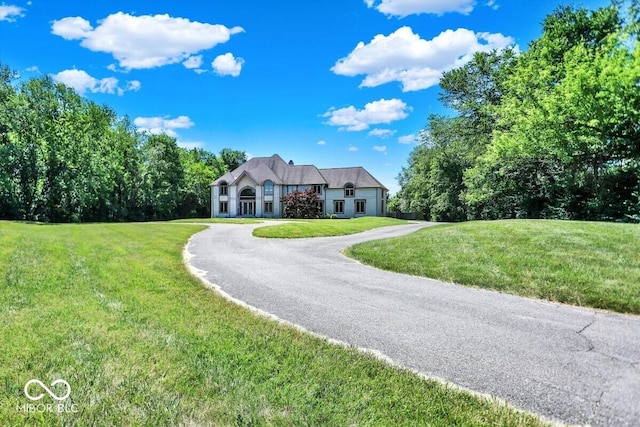 11575 Freeport Dr, Carmel, IN 46032 - french country home featuring a front yard and driveway