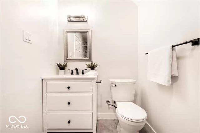 918 S State Ave, Indianapolis, IN 46203 - bathroom with vanity, baseboards, and toilet