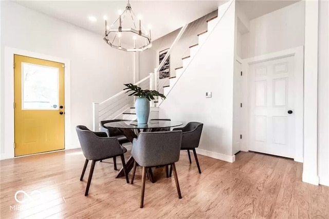 918 S State Ave, Indianapolis, IN 46203 - dining room with a chandelier, light wood finished floors, stairs, and baseboards