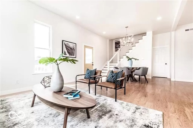 918 S State Ave, Indianapolis, IN 46203 - living area with stairway, light wood-style floors, a chandelier, baseboards, and recessed lighting