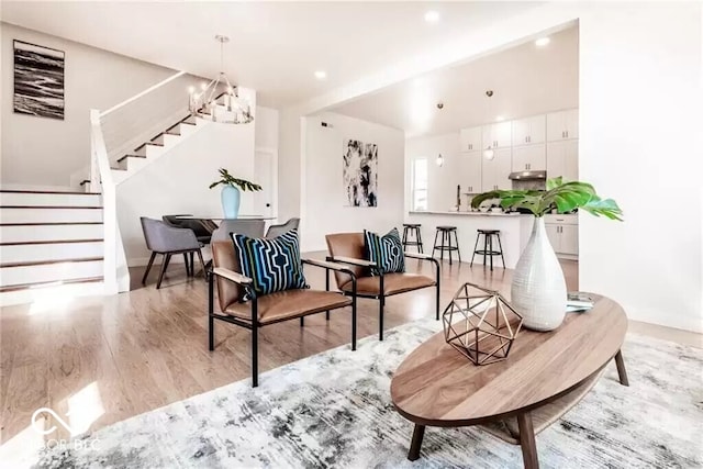 918 S State Ave, Indianapolis, IN 46203 - living area featuring stairs, light wood-type flooring, a chandelier, baseboards, and recessed lighting