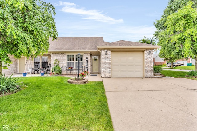 2044 Flamingo Way, Franklin, IN 46131 - view of front of home featuring concrete driveway, a garage, a front yard, and brick siding