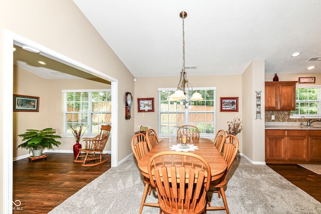 11692 Seven Oaks Dr, Fishers, IN 46038 - dining room with dark wood-type flooring, a chandelier, recessed lighting, baseboards, and vaulted ceiling