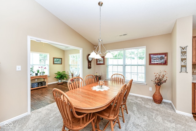 11692 Seven Oaks Dr, Fishers, IN 46038 - dining space with a chandelier, baseboards, and lofted ceiling