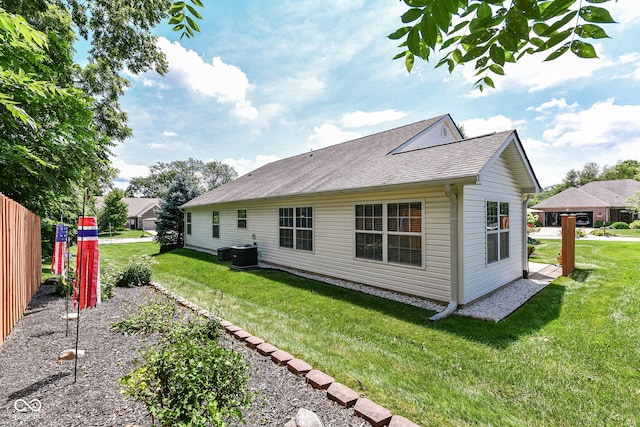 11692 Seven Oaks Dr, Fishers, IN 46038 - back of house with central air condition unit and roof with shingles
