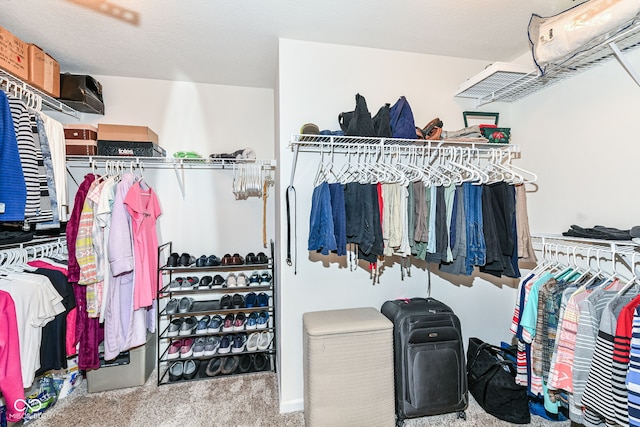11692 Seven Oaks Dr, Fishers, IN 46038 - walk in closet featuring carpet