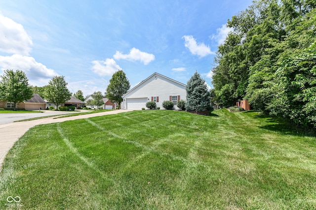 11692 Seven Oaks Dr, Fishers, IN 46038 - view of side of home featuring a lawn and a garage