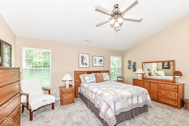 11692 Seven Oaks Dr, Fishers, IN 46038 - bedroom with light colored carpet, multiple windows, lofted ceiling, and a ceiling fan