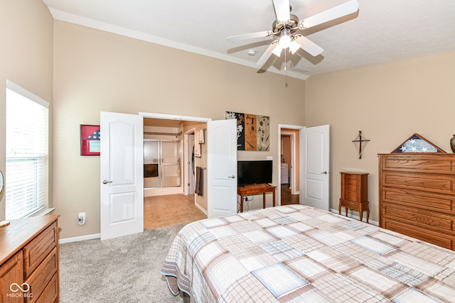 11692 Seven Oaks Dr, Fishers, IN 46038 - bedroom featuring light carpet, high vaulted ceiling, baseboards, and ceiling fan