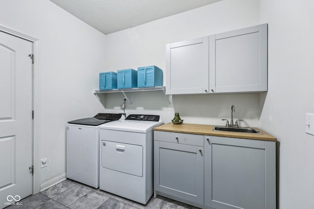 14458 Carlow Run, Carmel, IN 46074 - laundry room featuring washing machine and dryer and cabinet space