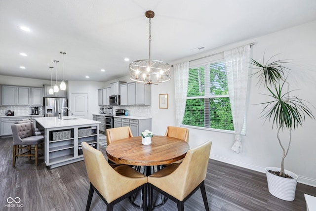 14458 Carlow Run, Carmel, IN 46074 - dining space with a chandelier, dark wood-style flooring, baseboards, and recessed lighting
