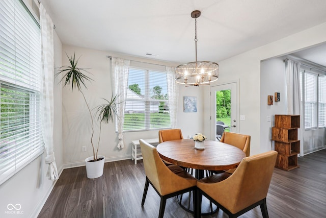 14458 Carlow Run, Carmel, IN 46074 - dining area featuring a chandelier, healthy amount of natural light, dark wood-style floors, and baseboards