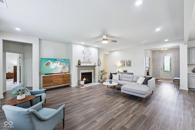 14458 Carlow Run, Carmel, IN 46074 - living room featuring dark wood-style flooring, recessed lighting, a ceiling fan, a fireplace, and baseboards
