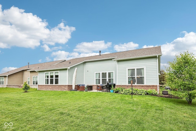 14458 Carlow Run, Carmel, IN 46074 - back of property featuring brick siding, a yard, and a patio