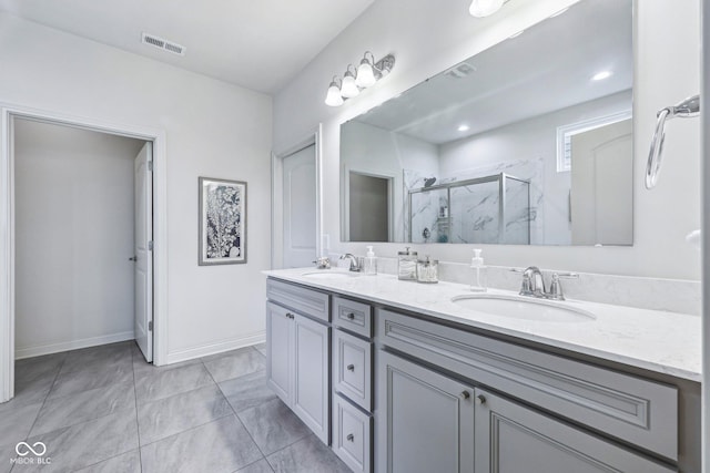 14458 Carlow Run, Carmel, IN 46074 - bathroom featuring double vanity, a marble finish shower, and baseboards
