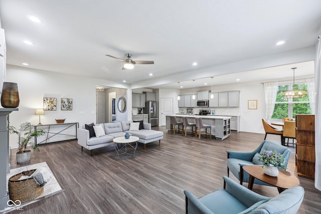 14458 Carlow Run, Carmel, IN 46074 - living area featuring dark wood-type flooring, ceiling fan, recessed lighting, and a chandelier