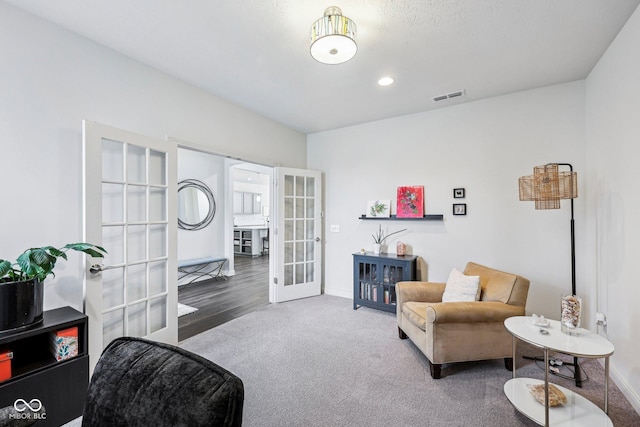 14458 Carlow Run, Carmel, IN 46074 - living area with french doors, baseboards, and carpet