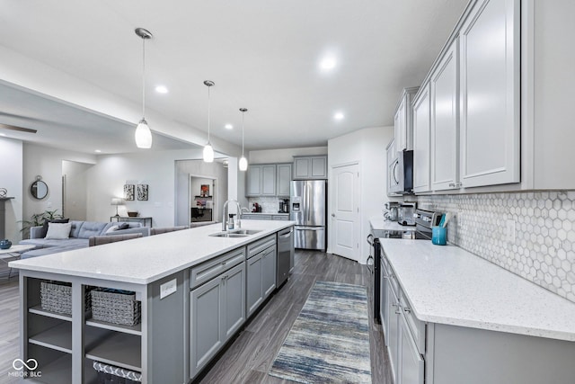 14458 Carlow Run, Carmel, IN 46074 - kitchen featuring appliances with stainless steel finishes, gray cabinets, a sink, open floor plan, and recessed lighting
