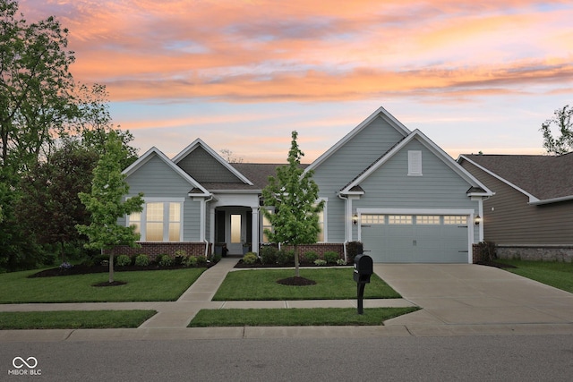 14458 Carlow Run, Carmel, IN 46074 - craftsman house featuring a front yard, driveway, brick siding, and a garage