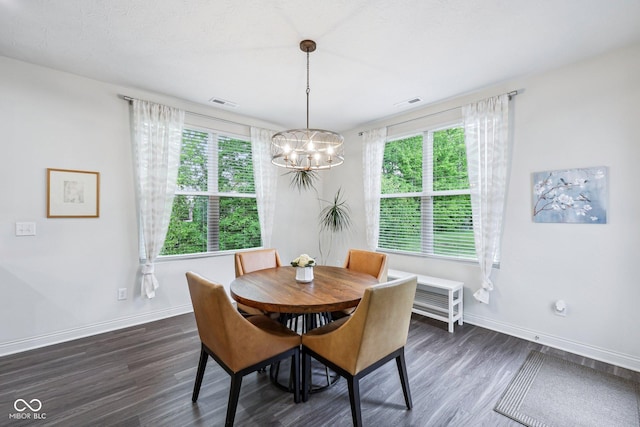 14458 Carlow Run, Carmel, IN 46074 - dining area featuring a chandelier, healthy amount of natural light, and dark wood-style floors