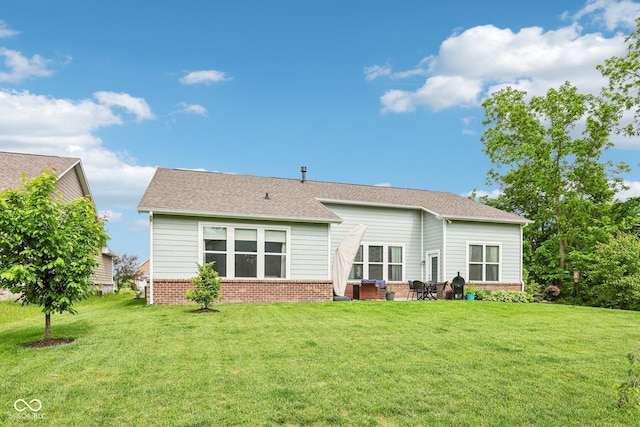 14458 Carlow Run, Carmel, IN 46074 - rear view of property featuring brick siding, a yard, and a patio area
