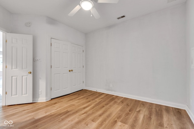 6610 Royal Oakland Dr, Indianapolis, IN 46236 - unfurnished bedroom featuring light wood-type flooring, baseboards, lofted ceiling, a closet, and ceiling fan