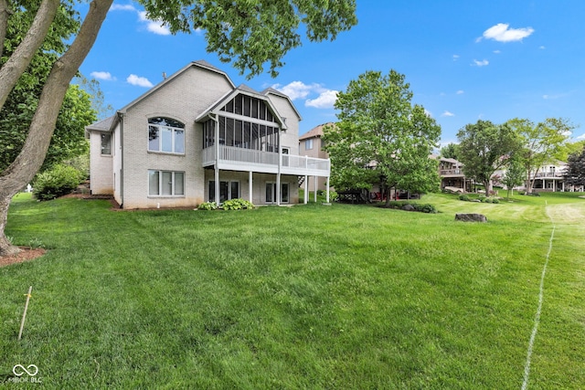 6610 Royal Oakland Dr, Indianapolis, IN 46236 - back of property featuring a sunroom, a lawn, and brick siding