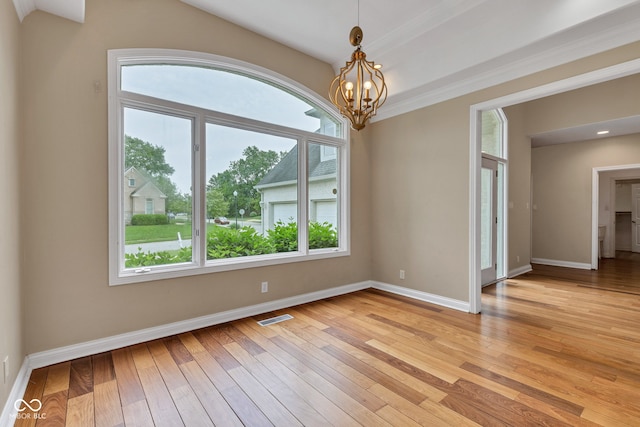 6610 Royal Oakland Dr, Indianapolis, IN 46236 - empty room featuring plenty of natural light, light wood-style floors, a chandelier, and baseboards