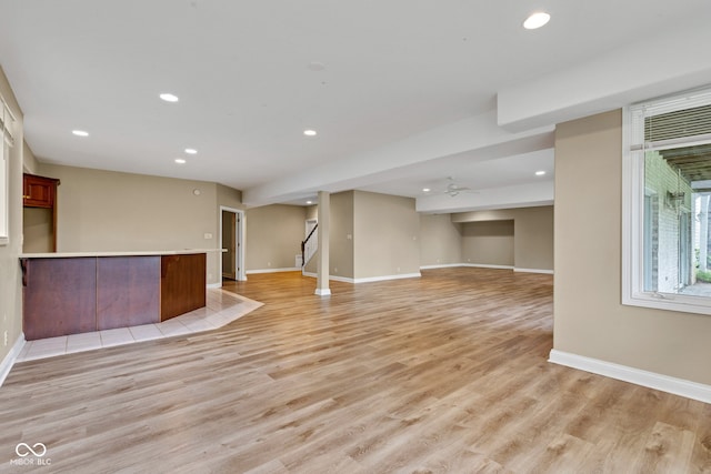 6610 Royal Oakland Dr, Indianapolis, IN 46236 - unfurnished living room with baseboards, recessed lighting, light wood finished floors, stairs, and ceiling fan