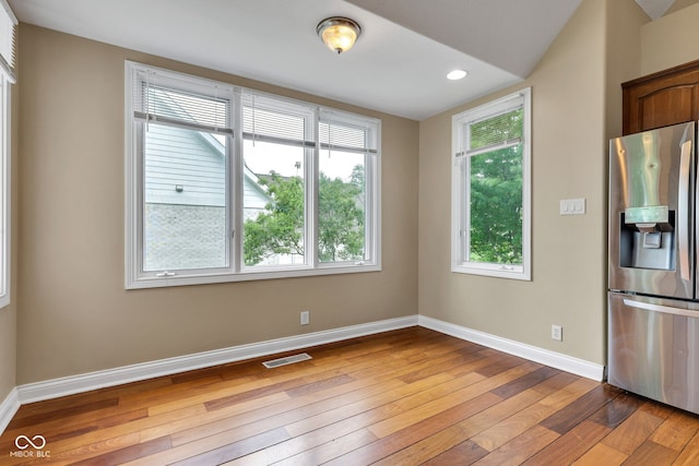 6610 Royal Oakland Dr, Indianapolis, IN 46236 - kitchen featuring stainless steel fridge with ice dispenser, light wood-style flooring, baseboards, and recessed lighting
