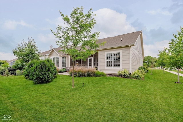 15593 Marsden Dr, Westfield, IN 46074 - back of house with a yard and a sunroom